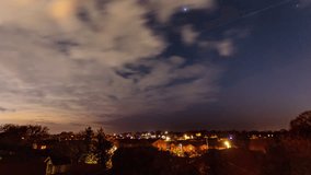 4K time lapse video of stars over a housing estate, North Wales