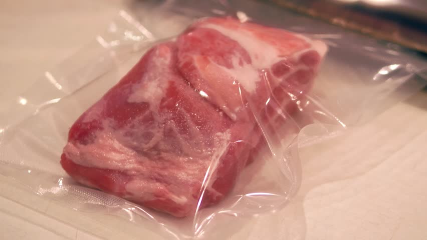 Raw meat being vacuum packed for sous vide cooking Royalty-Free Stock Footage #33978934