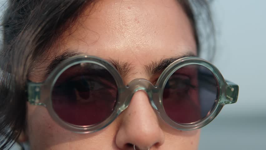 Close-up of a woman with glasses looking into the camera. Concept. Woman with glasses