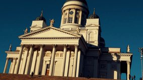 4k video of Helsinki city center including white church and market square area. It also shows some tourists.