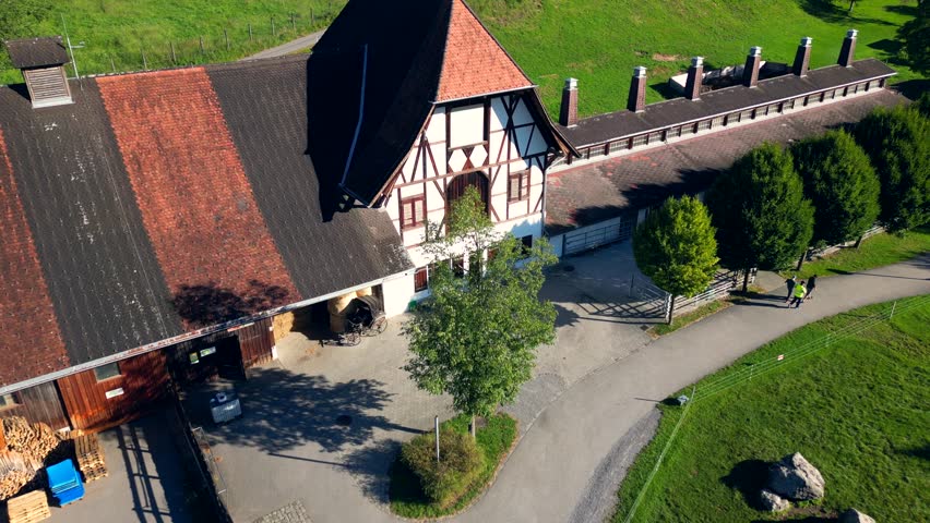old farm, drone shot push out, midday sunlight, green trees, landscape