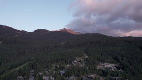 Aerial drone footage of luxury homes near ski hill in Whistler, BC, high end real estate, mountain home, cabin, luxury. 4K 24FPS.
