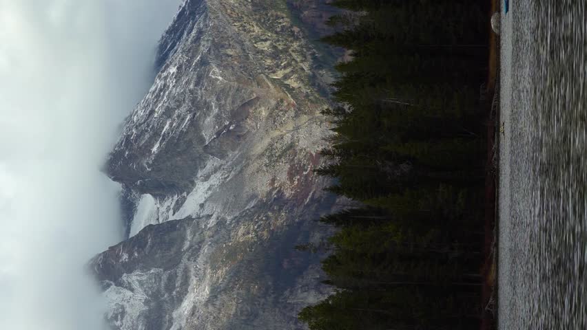 String Lake, Boat and Mountains. Grand Teton National Park, Wyoming, USA. Wide Shot. Vertical Video
