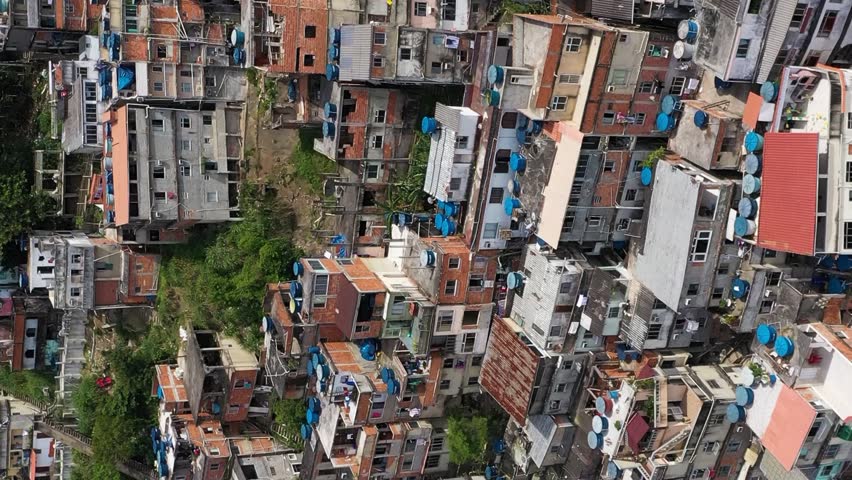 Cantagalo and Pavao-Pavaozinho Favelas. Rio de Janeiro, Brazil. Aerial View. Drone Flies Backwards and Upwards. Vertical Video Royalty-Free Stock Footage #3398118691