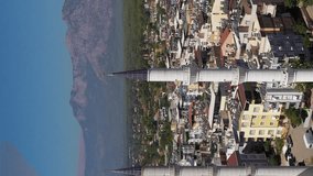 Minarets of Mosque, Cityscape and Mountains. Antalya Turkey. Aerial View. Orbiting. Vertical Video