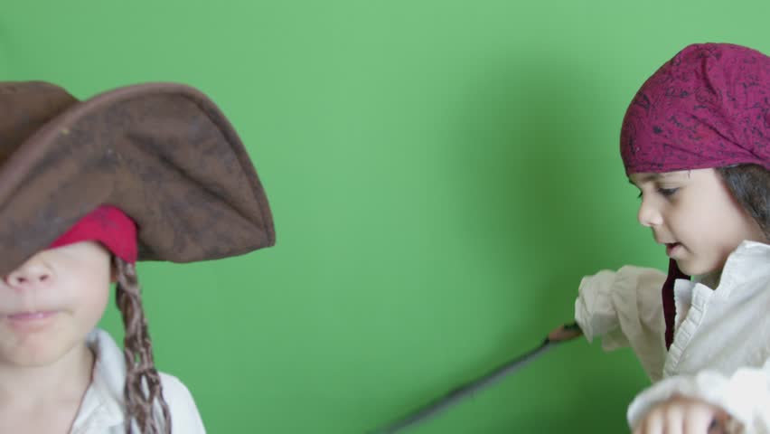 Pirate dancing while captain is thinking in front. Isolated on green background, slow motion. High quality 4k footage