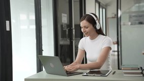 Gen Z young student girl in headphones studying internet at laptop Listen to audio narration Webinars Writing notes, listening to podcasts online, woman taking listening training course - Powered by Shutterstock - Get 15% off with code: PIKWIZARD15