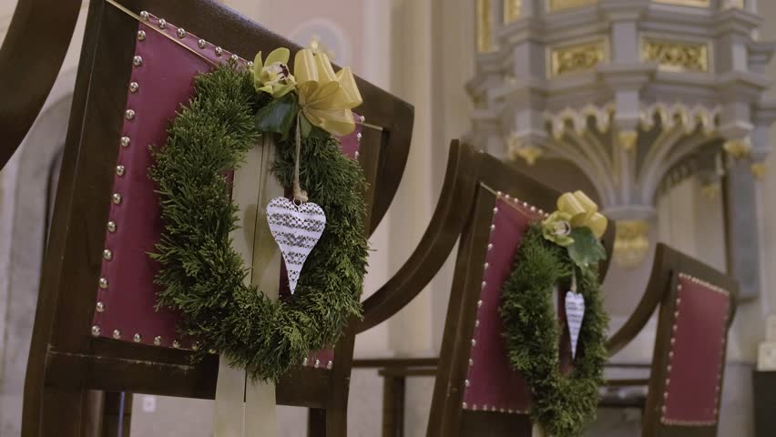 Red Wedding Thrones, Chairs For Groom and Bride, Witnesses In Church, Equipped With Green Wreath, Garland With Hanging Decorative Heart Shaped Sign Embellishment In It, Golden Decorative Bow or Ribbon - Powered by Shutterstock - Get 15% off with code: PIKWIZARD15