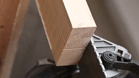 Master cuts the board with a circular saw in the workshop. . Vertical video. 