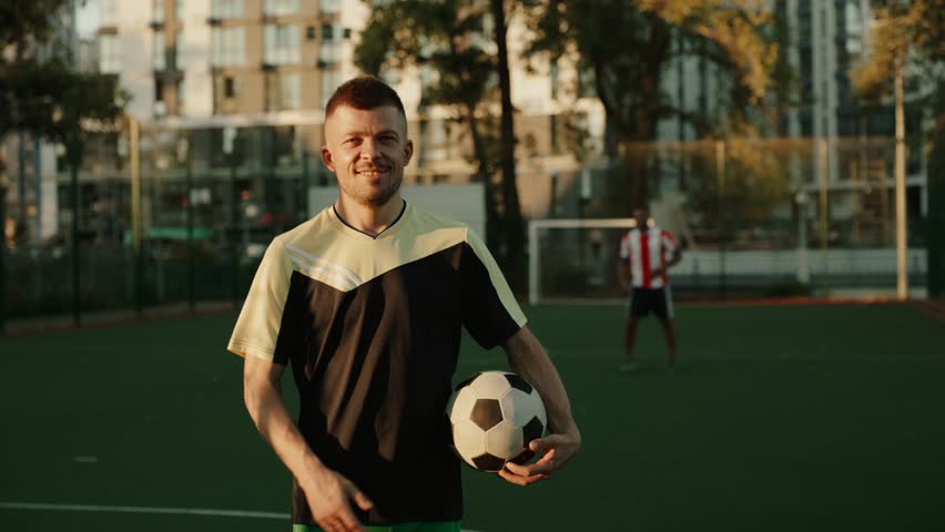 Football player with ball on the field