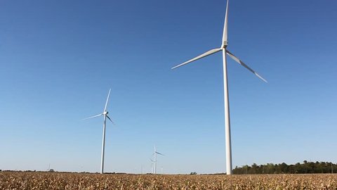 Movie of Wind turbines turning in a slight breeze in Western Ohio. The sound of crickets is heard in the background as the turbine turns. 
