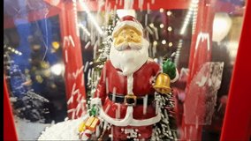 Santa Claus in big red lantern with falling snowflakes - Powered by Shutterstock - Get 15% off with code: PIKWIZARD15