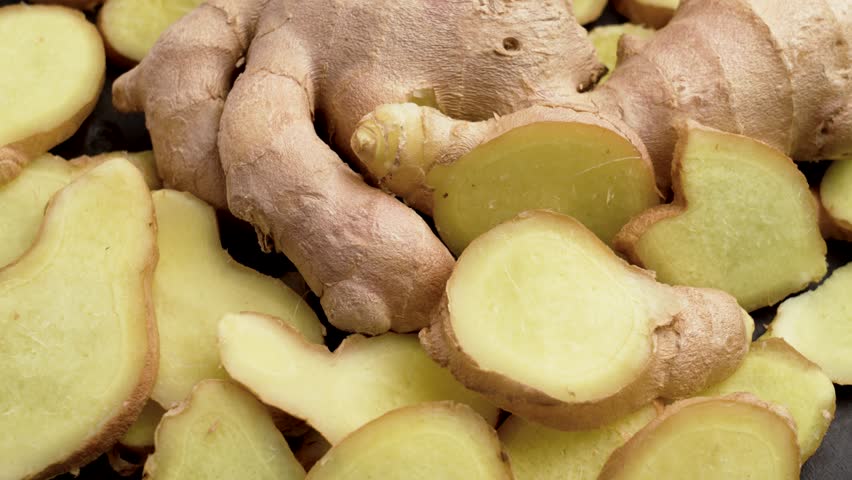 Ginger roots. Raw natural organic herb spice. Alternative herbal aromatic medicine ingredient. Rotation