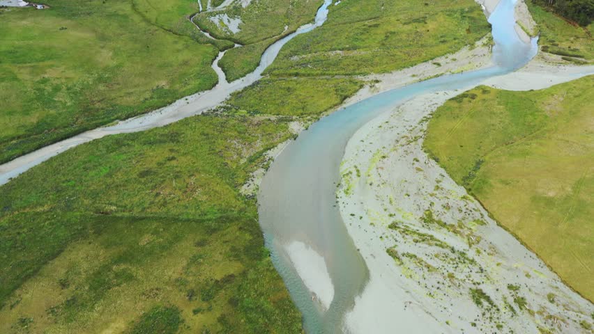 Eglington valley and river in Fiordland of New Zealand – aerial landscape as 4k.
