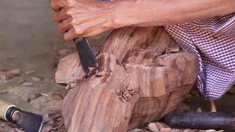 Burmese man are making wooden souvenirs for tourists in Bagan, Myanmar. Wood Carving is a traditional handicraft in Myanmar, Burma