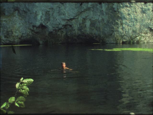 Vintage 8 mm film: Children swimming in lake 
