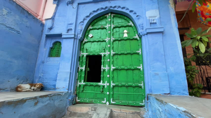 The green traditional door and blue house of Jodhpur, a city in Rajasthan, India Royalty-Free Stock Footage #3399141141
