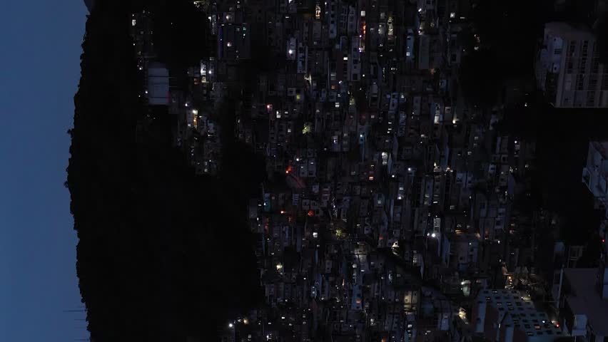Cantagalo-Pavao-Pavaozinho Favelas at Evening Twilight. Blue Hour. Rio de Janeiro, Brazil. Aerial View. Orbiting. Vertical Video Royalty-Free Stock Footage #3399197241
