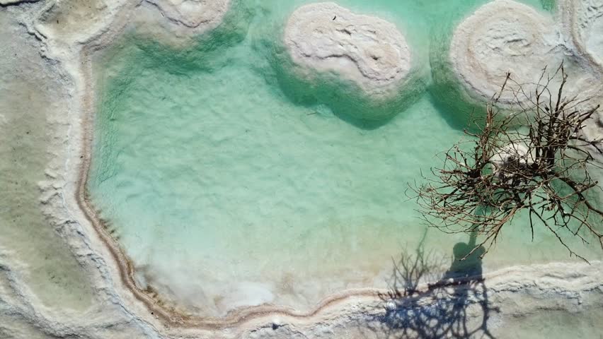 Aerial footage of Round shaped Salt deposits in the heart of the Dead Sea.
