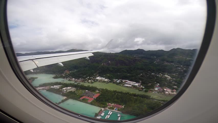 Plane landing in Seychelles, Airport in Mahe near Victoria, view of Seychelles from the plane, airport, runway, dream trips, exotic dream journey