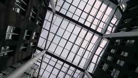 Atrium glass roof of yard inside building - business center, hotel or trade shopping. High quality FullHD footage - Powered by Shutterstock - Get 15% off with code: PIKWIZARD15