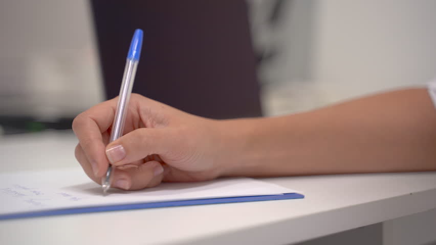 Close Up Of The Hand Of A Female Doctor Writing The Symptoms And Prescription Of A Patient In Her Office Royalty-Free Stock Footage #3399594189