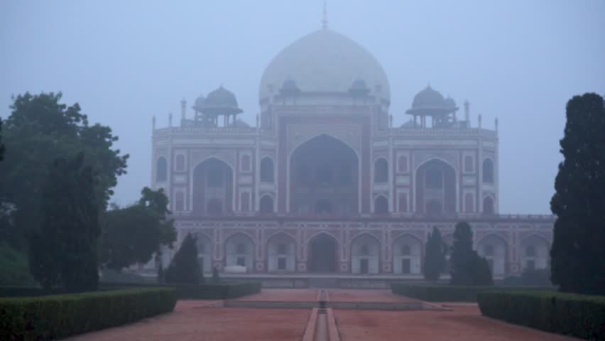 Closeup view of Humayun tomb with all over fog around it in Delhi, India