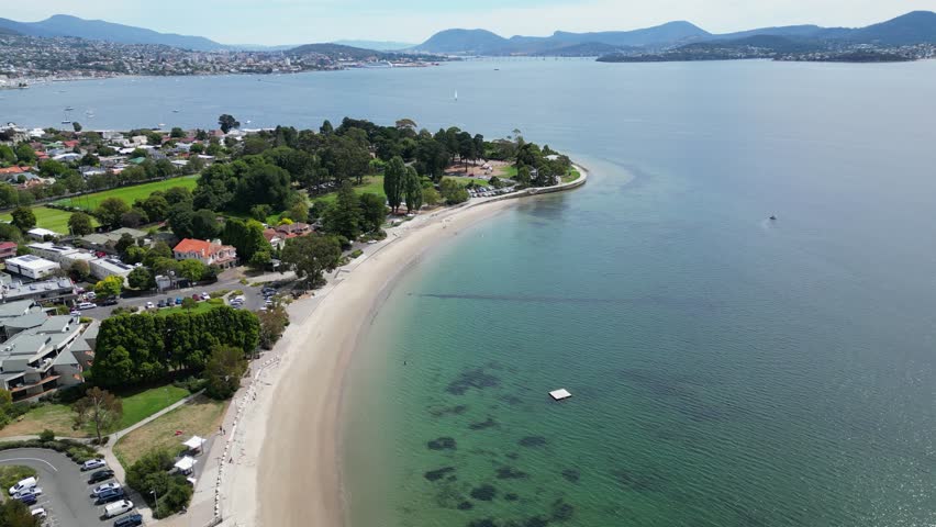 An aerial of Hobart city in Tasmania, Australia alongside the blue sea during the daytime