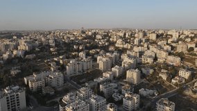 An aerial video of the white residential tall buildings, Ramallah city, Palestine