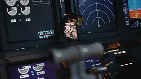 Airplane Technology in Pilot Cabin on Plane Control Panel Closeup. Military Aircraft is Ready for Flight at Dark Night Time. Close-Up View on Displays Screens and Operating Radars in Aviator Cockpit - Powered by Shutterstock - Get 15% off with code: PIKWIZARD15