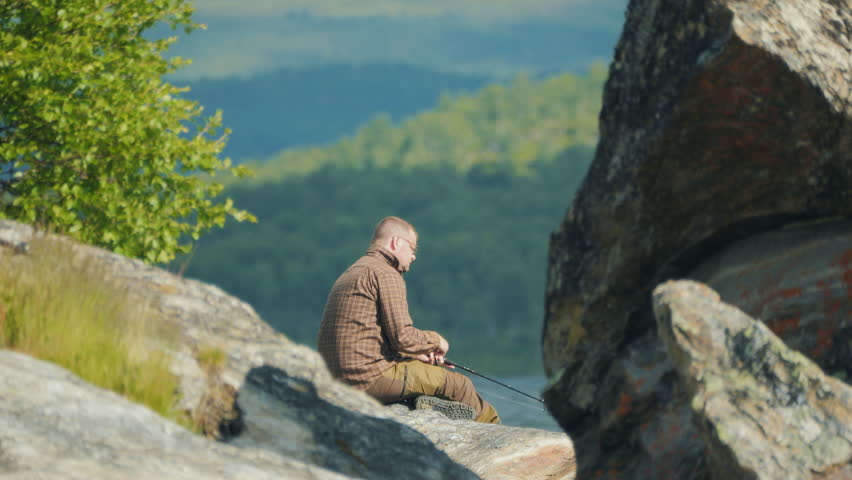American Man fishing alone, solitude and self-reflection concept