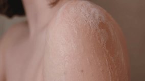 Cropped View Of A Woman Using Bath Loofah While Taking Shower At Home. Close-up Shot - Powered by Shutterstock - Get 15% off with code: PIKWIZARD15