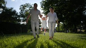 happy family. parents and baby walking in park holding hands silhouette. happy family kid dream concept. friendly family and baby are resting in nature walking in lifestyle the woods couple - Powered by Shutterstock - Get 15% off with code: PIKWIZARD15
