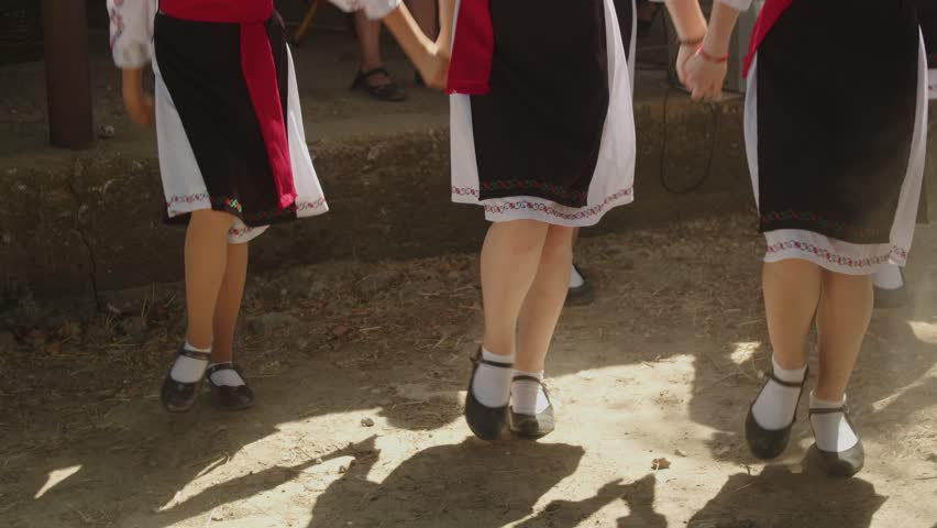 A group of young girls dancing a traditional romanian moldavian dance 