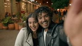 In evening night city happy Indian Arabian couple in love woman man people make selfie photo webcam web camera view travel dating posing photographing picture together relationship vacation adventure - Powered by Shutterstock - Get 15% off with code: PIKWIZARD15