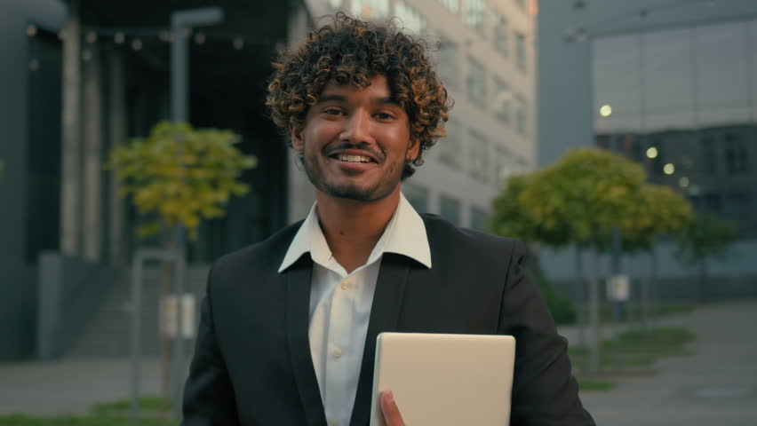 Indian guy student formal Arabian business man male employer entrepreneur manager worker intern businessman boss executive leader agent hold digital tablet posing in city portrait smiling at camera Royalty-Free Stock Footage #3400003285