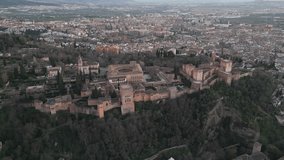 The Alhambra Fortress at dusk, Granada, region of Andalusia, south Spain. Aerial footage, panoramic view.