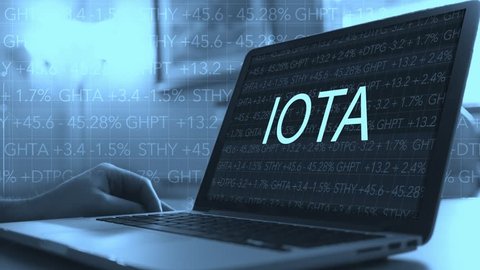 Cryptocurrency concept - IOTA on laptop screen for investing