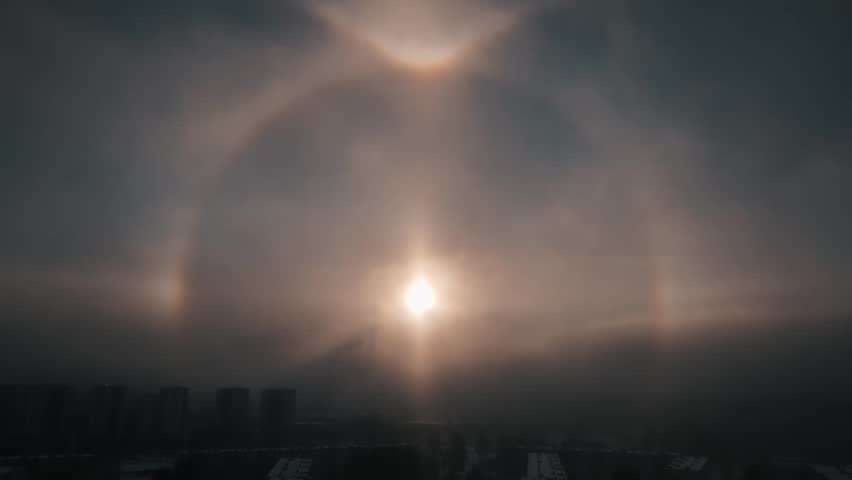 Sky over the city with halo, optical phenomenon, around the sun in winter, frosty morning Royalty-Free Stock Footage #3400440115