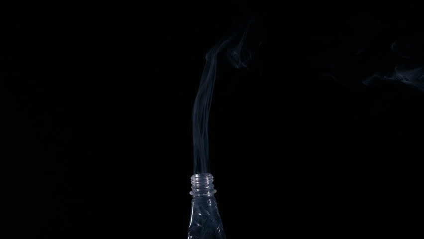 Toxic smoke from plastic. The plastic bottle smokes. The concept of burning plastic garbage. Royalty-Free Stock Footage #3400552103