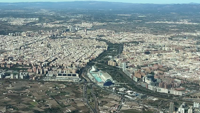 Aerial view of Valencia city center and the City of Science, shot from a jet cockpit arriving to the airport. 2000m high. Splendid sunny day.