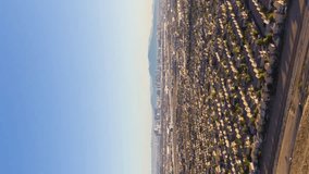 Las Vegas Skyline on Sunny Day, USA. Aerial Hyper Lapse, Time Lapse. Drone Flies Forward. Vertical Video