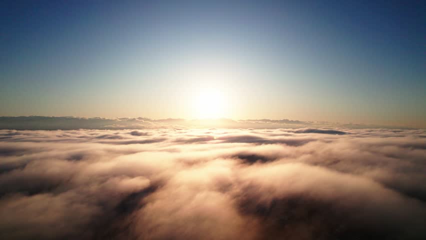 Bright Sun And Clouds In The Sky During Sunrise. - aerial shot