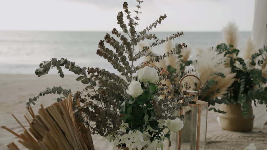 Wedding arch floral beach. Wedding western setting details beautiful roses flower. 