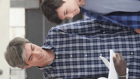 Students at high school talking to the teacher in the hallway. Vertical Video - Powered by Shutterstock - Get 15% off with code: PIKWIZARD15