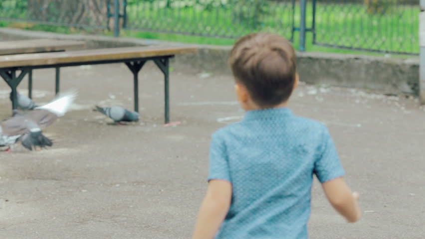 Happy Little Boy Run In The Park