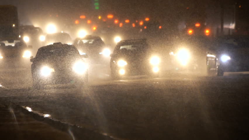 Cars moving in winter storm. Heavy snow and traffic at night. Royalty-Free Stock Footage #34008244