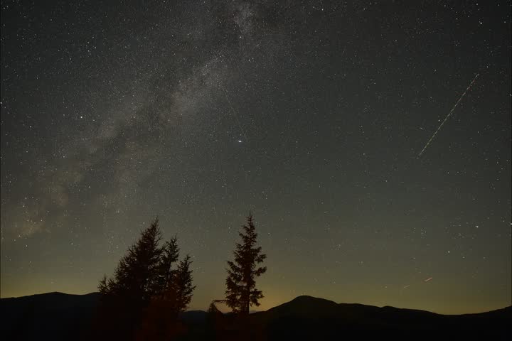 4k timelapse video with star sky, nature mountains landscape to Milky Way during a night of Perseid Meteor Shower observation.