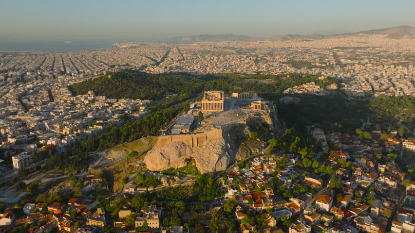 Circling aerial shot of the Acropolis with Athens old town in the foreground at sunrise Royalty-Free Stock Footage #3400858701