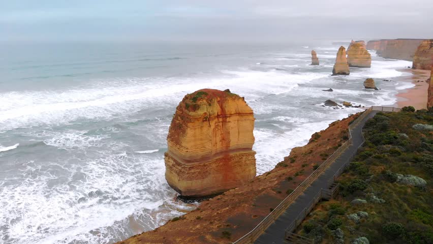 Panoramic aerial shoot of Twelve Apostles coastline from drone at dusk, Australia